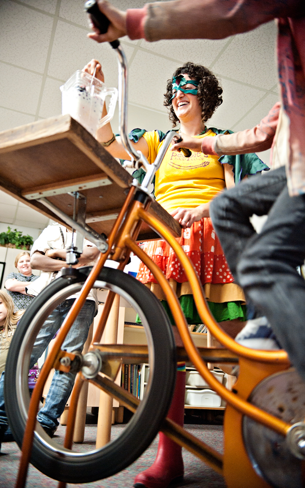 Using a pedal powered blender, Hether Frayer and students from Northglade Montessori Magnet School blend up some smoothies.