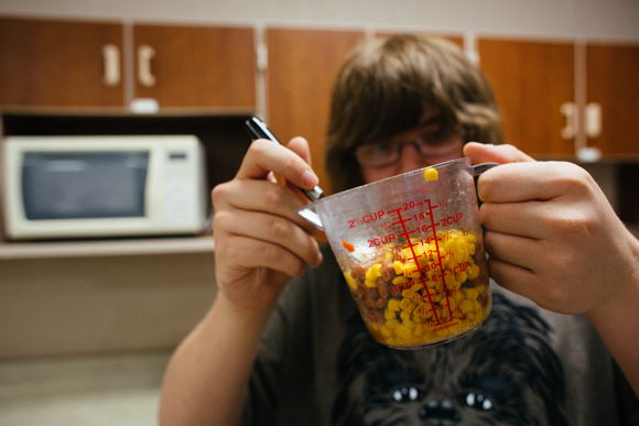 MEASURING OUT INGREDIENTS.